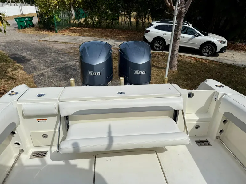 Slide: The Image of 2008 Hydra-Sports Vector 2900 CC boat with dual 300 HP engines, parked near a white SUV. - 7