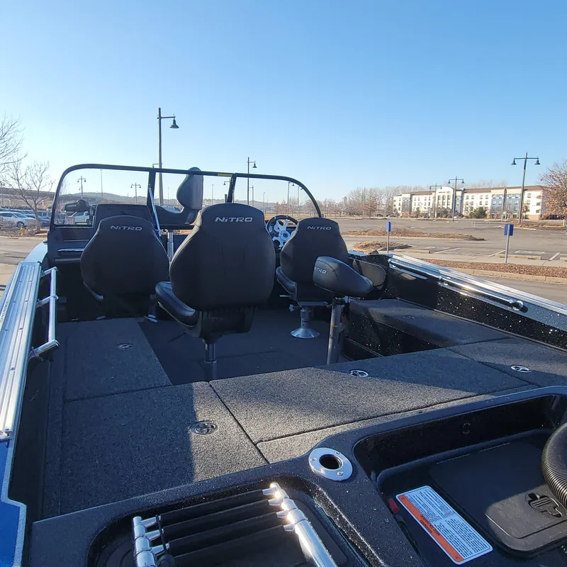 Slide: The Image of 2024 Nitro ZV20 Pro fishing boat interior with seating and storage compartments. - 4