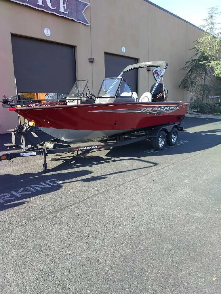 The Image of 2024 Tracker Targa V-19 WT boat on a trailer in a parking lot. - 0