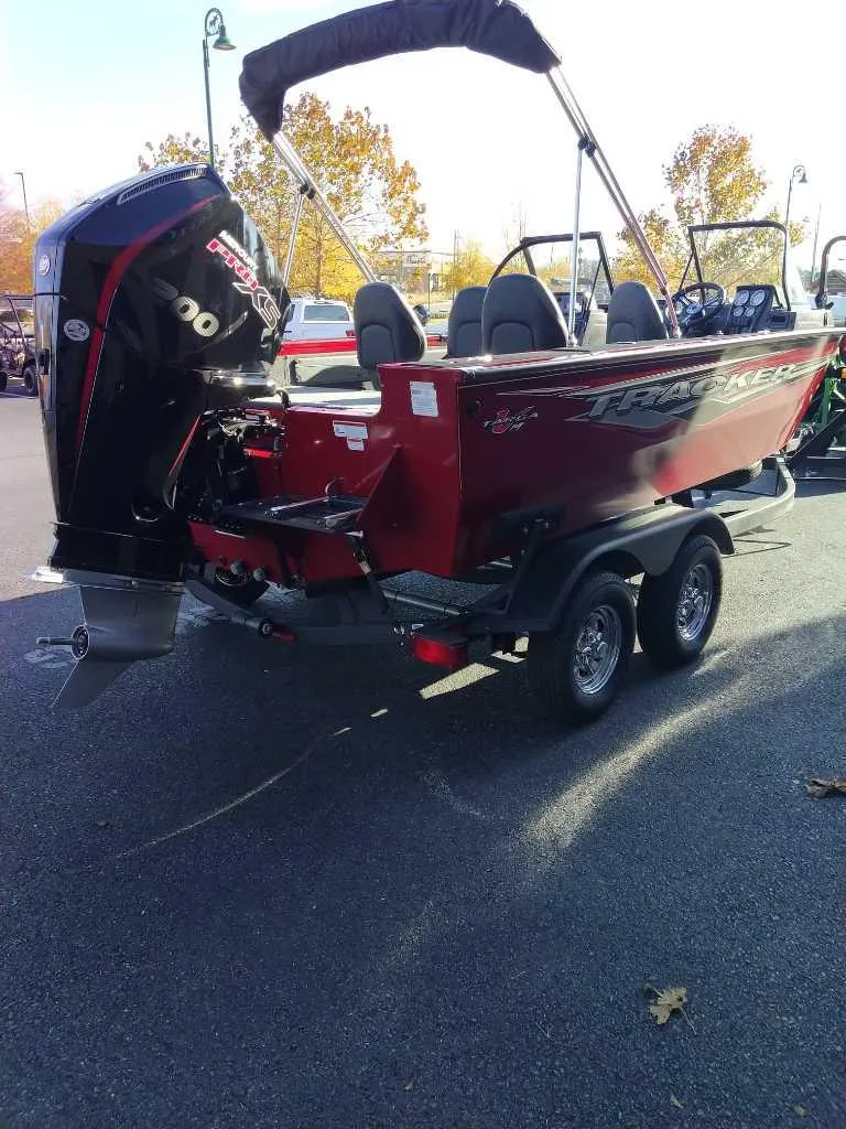 Slide: The Image of 2024 Tracker Targa V-19 WT boat with outboard motor on trailer. - 2