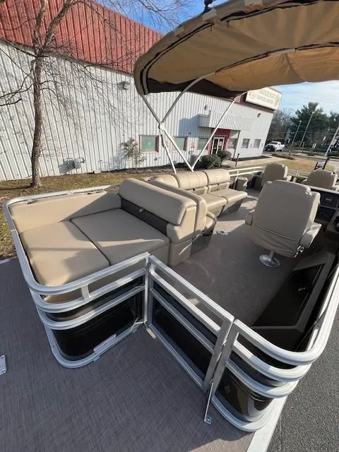 Slide: The Image of 2024 Sun Tracker Sportfish 24 XP3 pontoon boat with beige seating and canopy. - 14