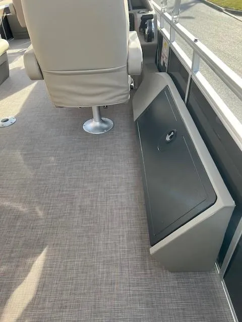 Slide: The Image of 2024 Sun Tracker Sportfish 24 XP3 boat interior with seating and storage. - 16