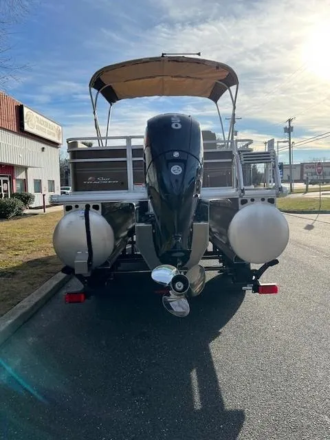 Slide: The Image of 2024 Sun Tracker Sportfish 24 XP3 pontoon boat with outboard motor. - 3