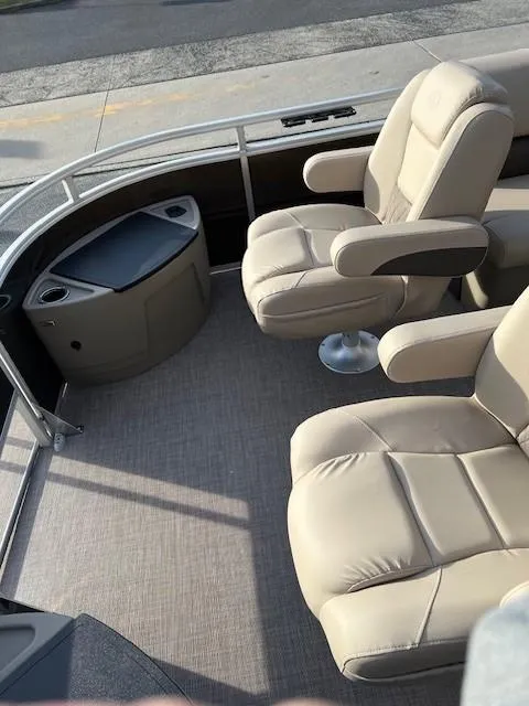 Slide: The Image of 2024 Sun Tracker Sportfish 24 XP3 boat interior with beige seating. - 8