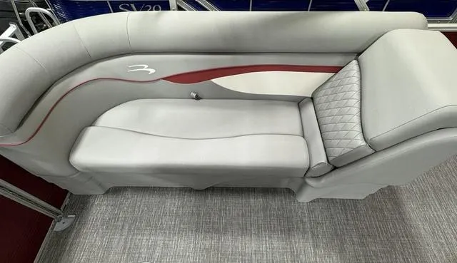 Slide: The Image of 2024 Bennington 20 SSR boat interior with gray and red cushioned seating. - 11