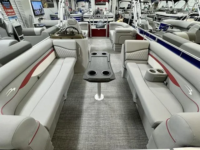 Slide: The Image of 2024 Bennington 20 SSR pontoon boat interior with spacious seating and cup holders. - 13