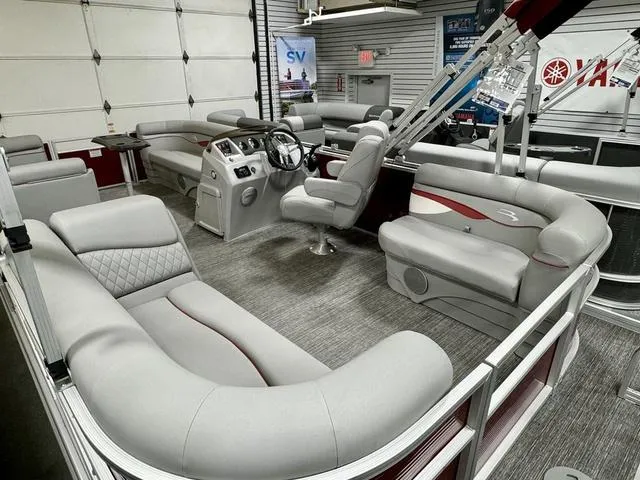 Slide: The Image of 2024 Bennington 20 SSR pontoon boat interior with plush seating and modern helm. - 14