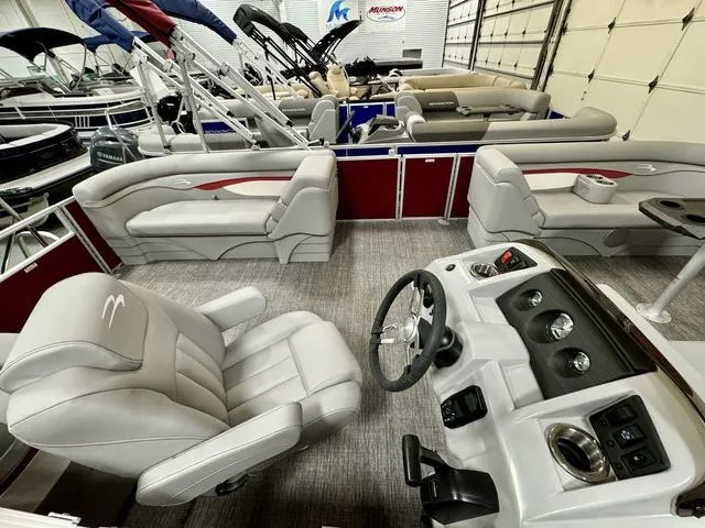 Slide: The Image of 2024 Bennington 20 SSR pontoon boat interior with plush seating and modern helm. - 15