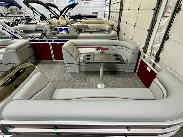 Slide: The Image of 2024 Bennington 20 SSR pontoon boat interior with gray seating and table. - 16