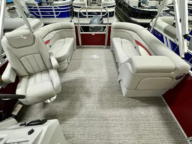 Slide: The Image of 2024 Bennington 20 SSR pontoon boat interior with plush seating and modern design. - 9