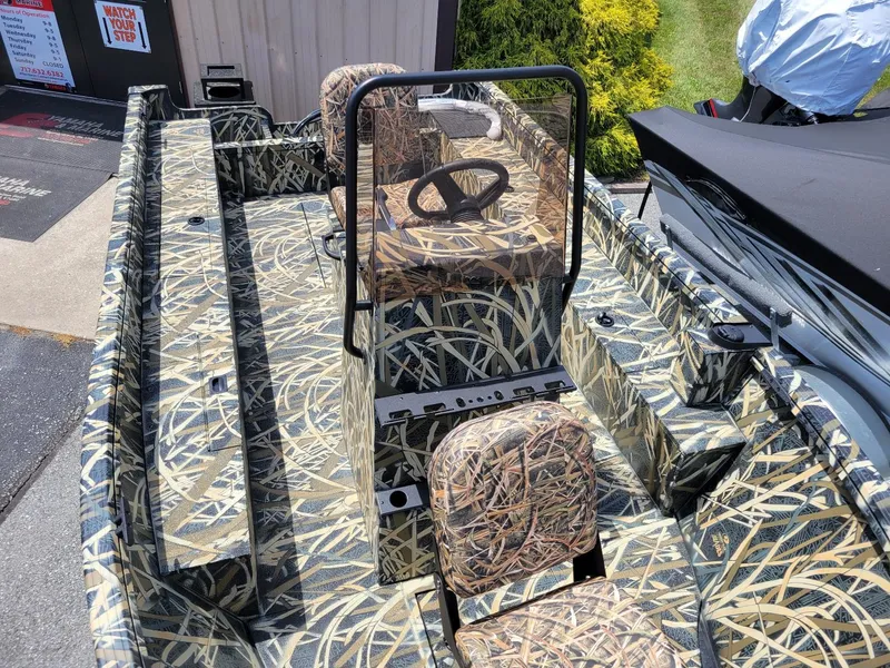 Slide: The Image of 2025 Smoker Craft Freedom 160 CC center console boat in camo pattern, in stock. - 11