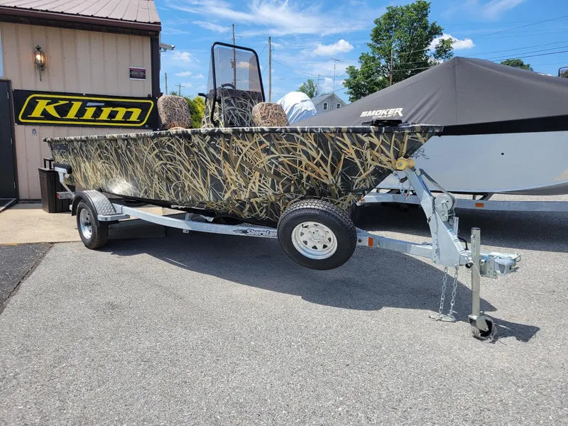 Slide: The Image of 2025 Smoker Craft Freedom 160 CC center console camo boat on trailer, in stock. - 4