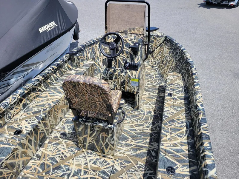 Slide: The Image of 2025 Smoker Craft Freedom 160 CC center console boat, camo design, in stock. - 5