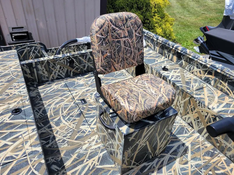 Slide: The Image of 2025 Smoker Craft Freedom 160 CC center console boat in camo pattern, featuring a camo seat. - 7