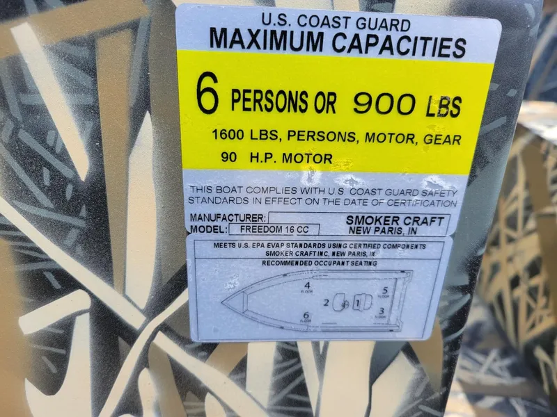 Slide: The Image of 2025 Smoker Craft Freedom 160 CC center console camo boat capacity label. - 9