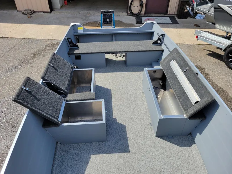 Slide: The Image of 2024 Smoker Craft 16 Big Fisherman DLX tiller boat interior with storage compartments. - 3