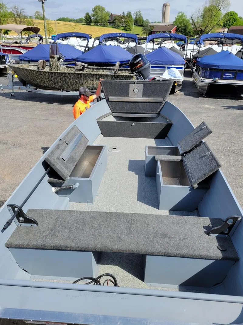 Slide: The Image of 2024 Smoker Craft 16 Big Fisherman DLX tiller boat, interior view, in stock at marina. - 8