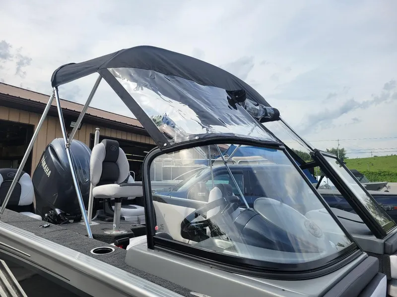 Slide: The Image of 2024 Smoker Craft Ultima Legacy 172 with Yamaha 150, featuring walk-thru windshield and canopy. - 13
