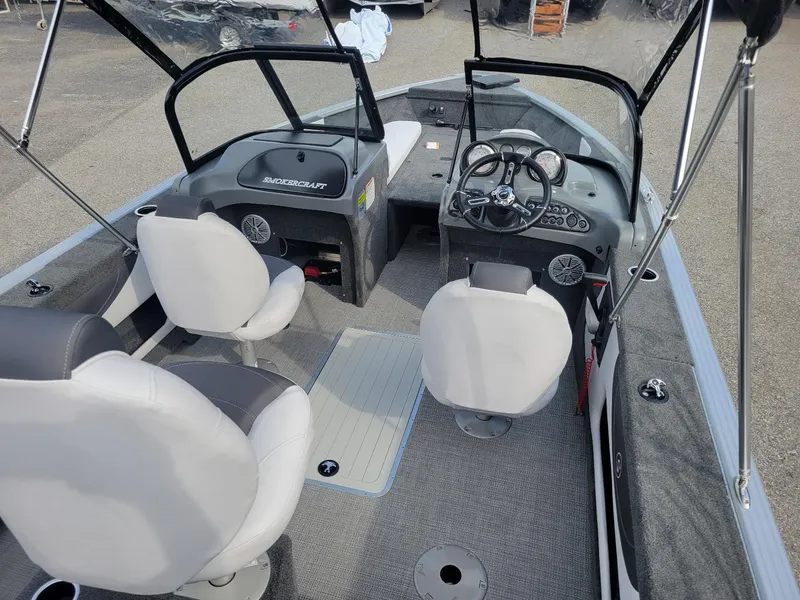 Slide: The Image of 2024 Smoker Craft Ultima Legacy 172 boat interior with walk-thru windshield and seating. - 14