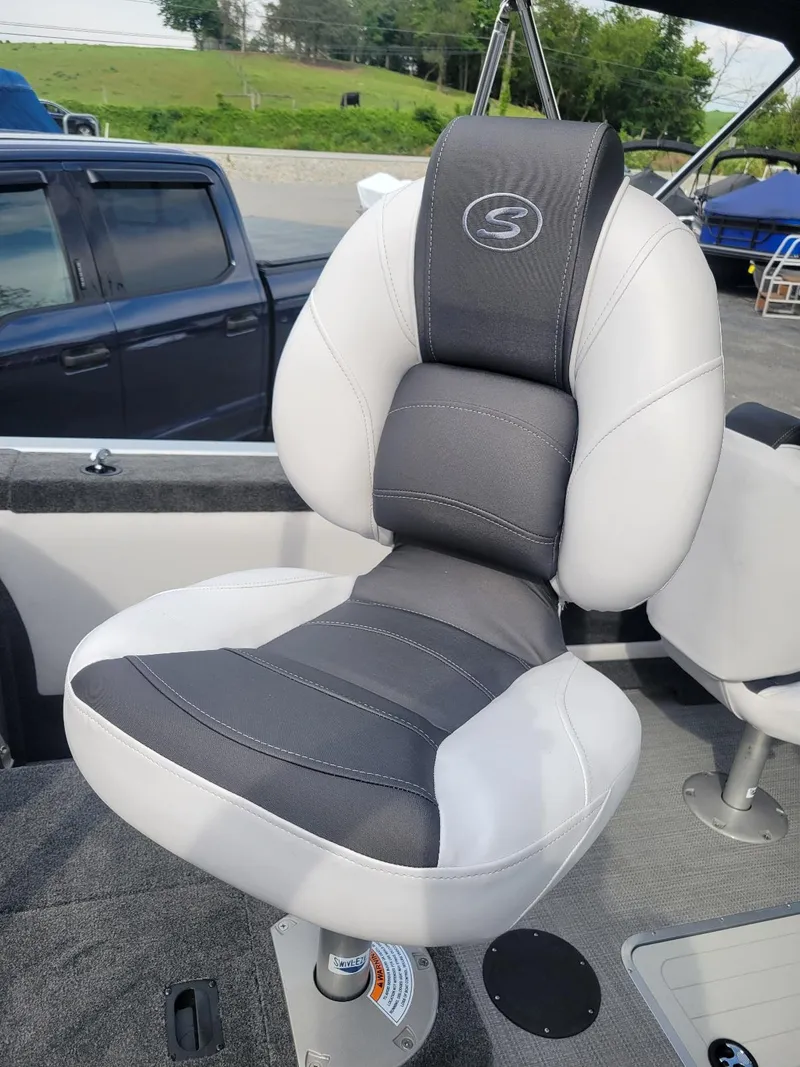 Slide: The Image of 2024 Smoker Craft Ultima Legacy 172 boat seat, gray and white design, walk-thru windshield model. - 15