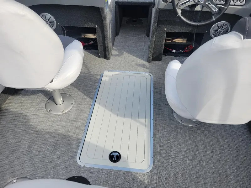 Slide: The Image of 2024 Smoker Craft Ultima Legacy 172 interior with walk-thru windshield and seating. - 16