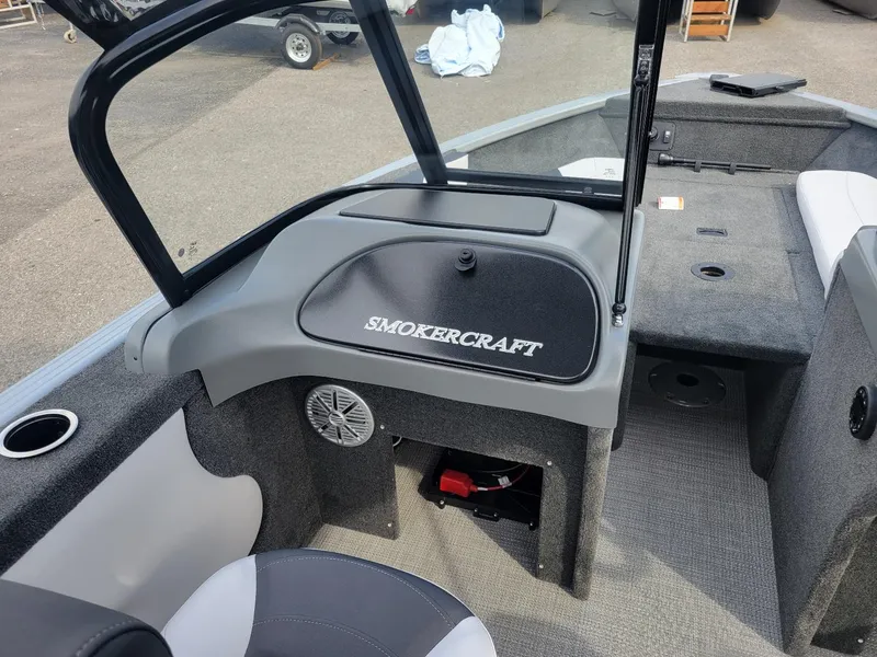 Slide: The Image of 2024 Smoker Craft Ultima Legacy 172 boat interior with walk-thru windshield and Yamaha 150. - 18