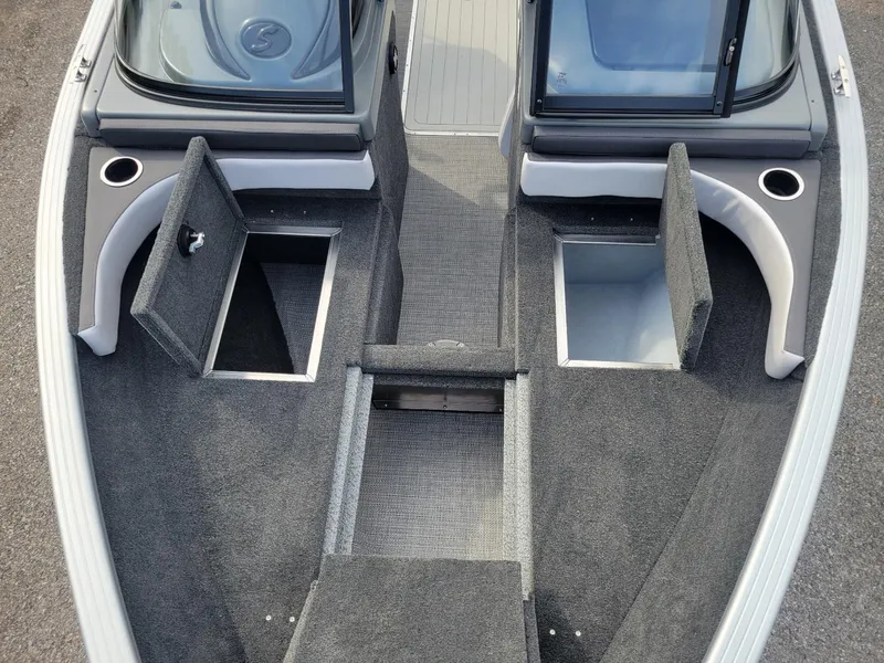 Slide: The Image of 2024 Smoker Craft Ultima Legacy 172 boat interior with storage compartments and walk-thru windshield. - 20