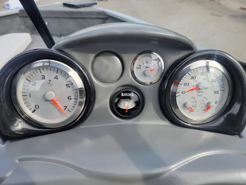 Slide: The Image of Dashboard of 2024 Smoker Craft Ultima Legacy 172 boat with gauges and compass. - 3