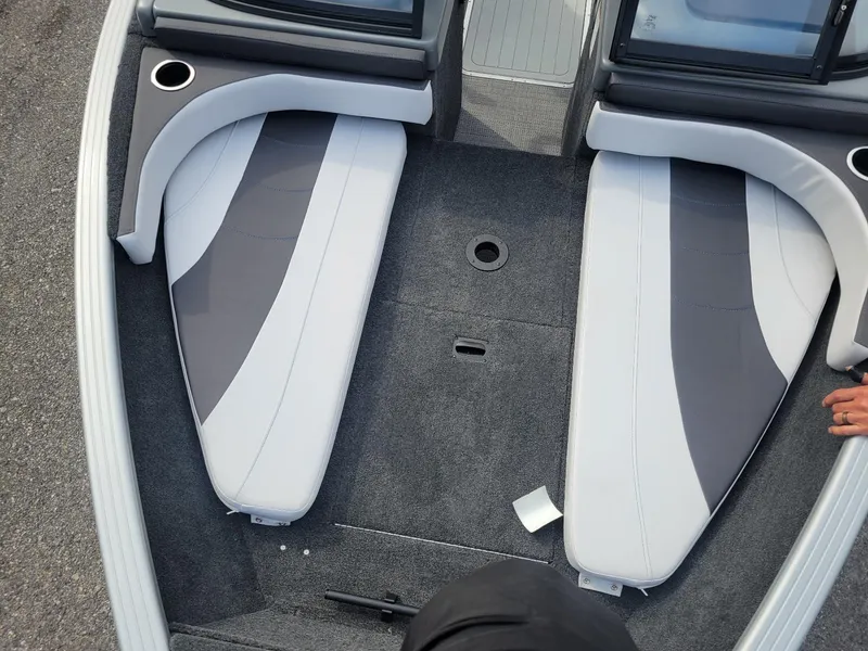 Slide: The Image of 2024 Smoker Craft Ultima Legacy 172 boat interior with gray and white seating. - 6