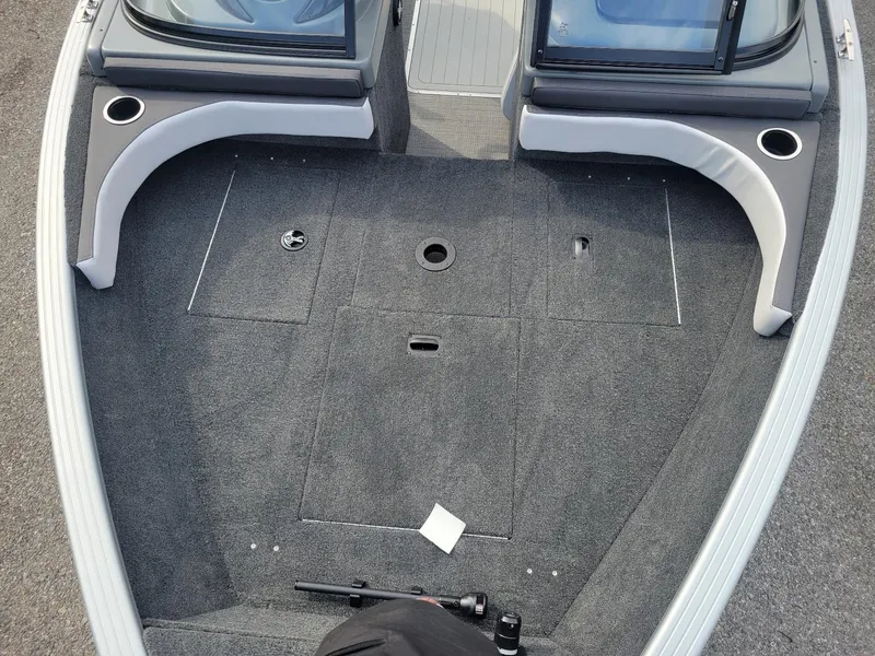 Slide: The Image of 2024 Smoker Craft Ultima Legacy 172 boat interior with walk-thru windshield, gray carpet. - 7