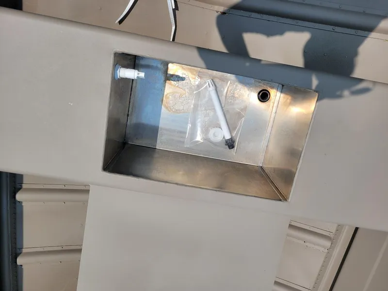 Slide: The Image of 2025 Smoker Craft 16 Voyager tiller boat interior with storage compartment. - 7