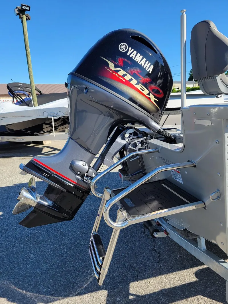 Slide: The Image of 2024 Smoker Craft Ultima 172 with Yamaha 115 engine, featuring walk-thru windshield. - 17