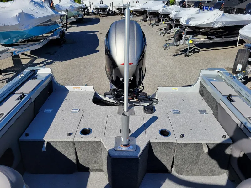 Slide: The Image of 2024 Smoker Craft Ultima 172 boat with Yamaha 115 engine, rear view in showroom. - 20