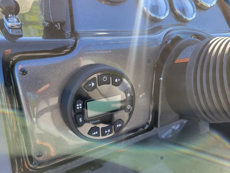 Slide: The Image of 2024 Smoker Craft Ultima 172 dashboard with Bluetooth control panel and gauges. - 22