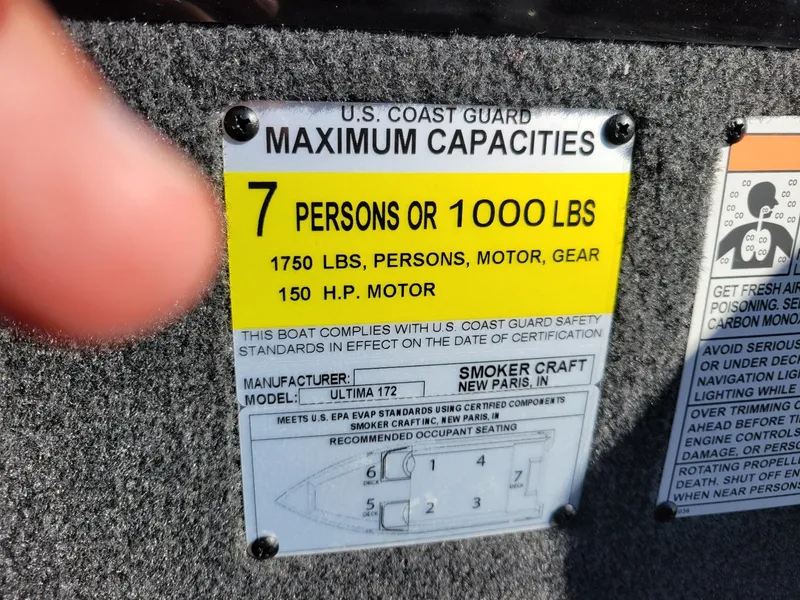 Slide: The Image of 2024 Smoker Craft Ultima 172 capacity label, 7 persons or 1000 lbs, 150 HP motor. - 24