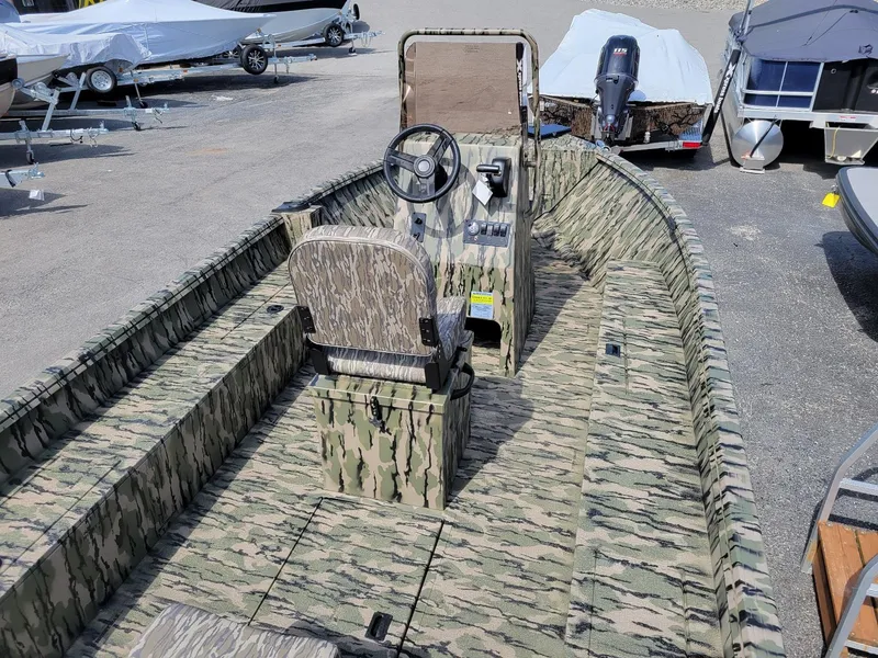 Slide: The Image of 2024 Smoker Craft Freedom 180 CC center console boat in camo, in stock, interior view. - 3