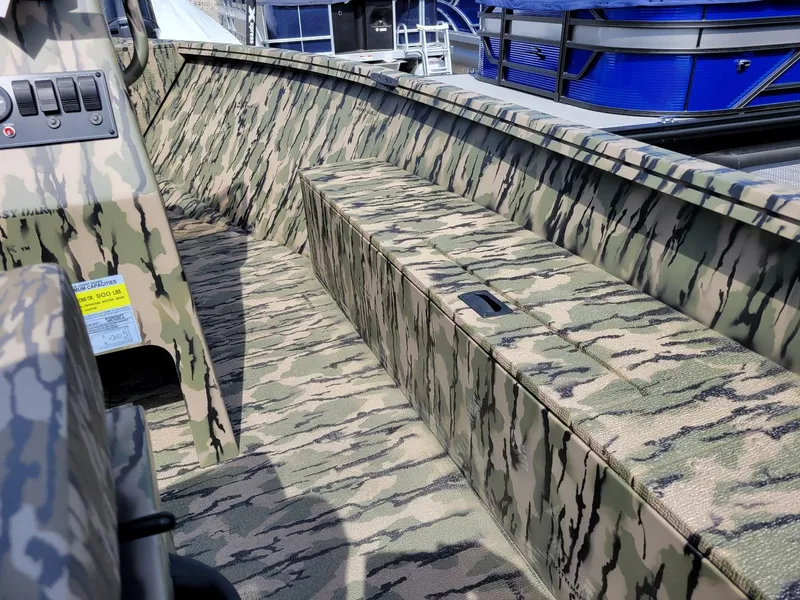 Slide: The Image of 2024 Smoker Craft Freedom 180 CC center console boat, camo design, in stock. - 6