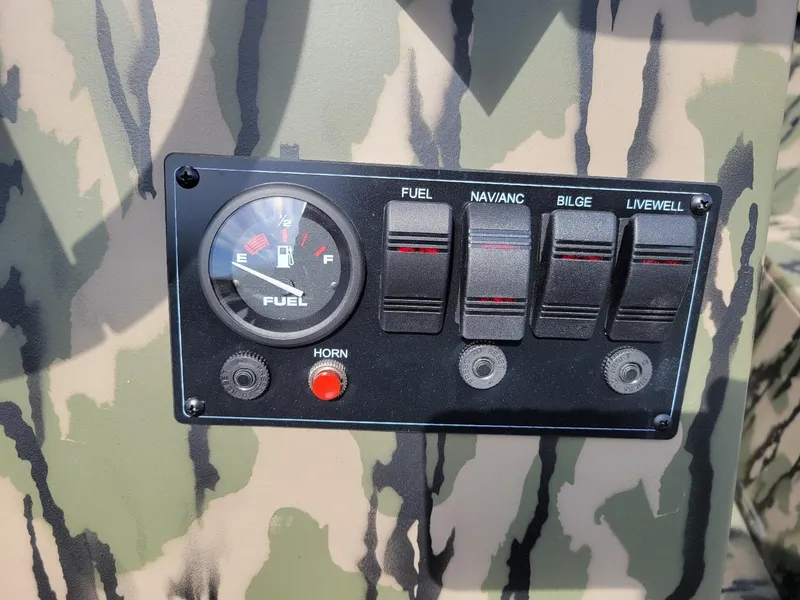 Slide: The Image of Control panel of 2024 Smoker Craft Freedom 180 CC center console, camo design. - 7