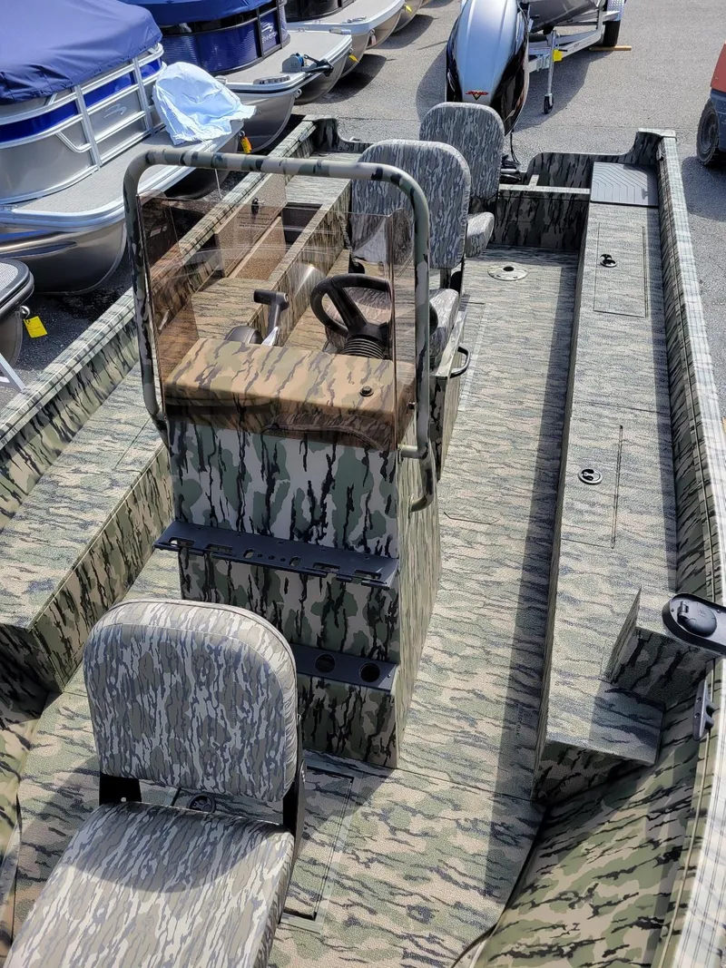Slide: The Image of 2024 Smoker Craft Freedom 180 CC center console boat in camo, available in stock. - 9
