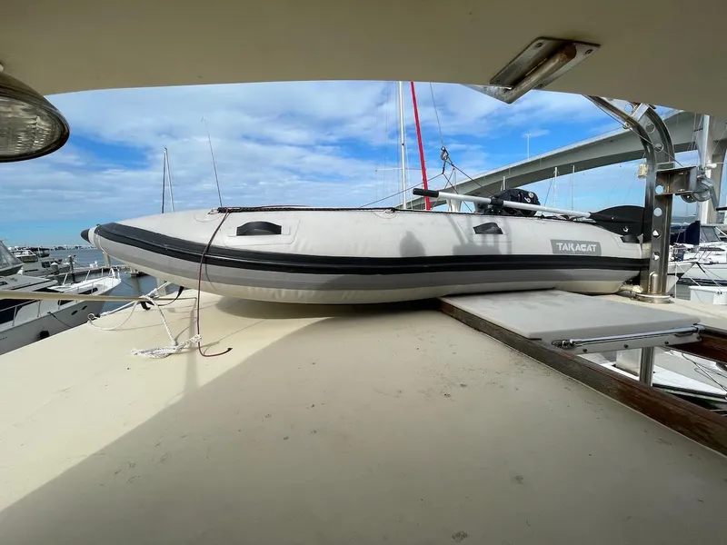 Slide: The Image of 1988 Kha Shing 40 Sundeck with a Takacat inflatable boat on deck. - 14