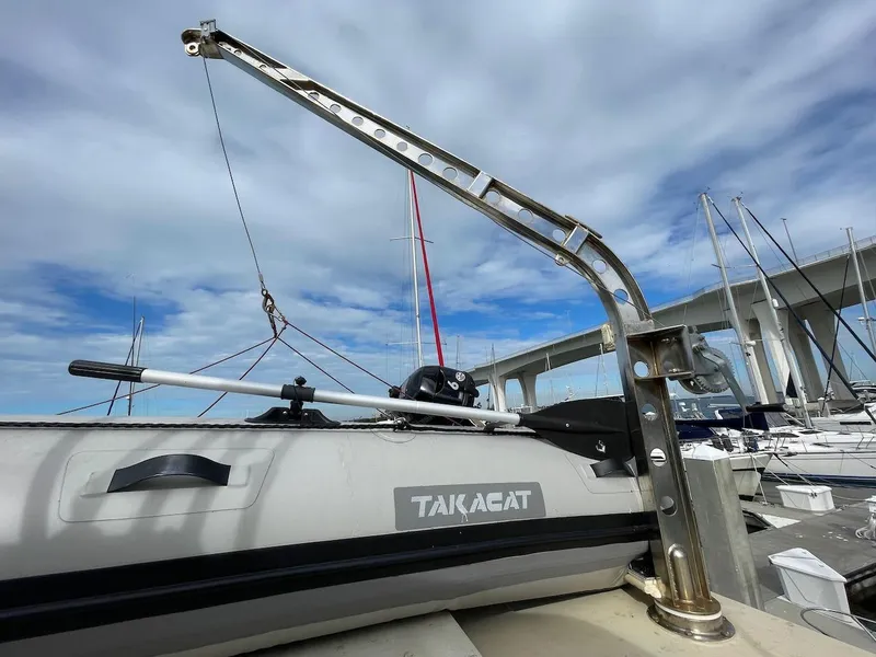 Slide: The Image of 1988 Kha Shing 40 Sundeck with TakaCat inflatable boat on davit system. - 16