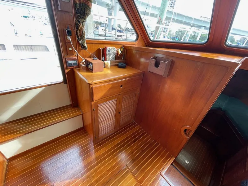 Slide: The Image of 1988 Kha Shing 40 Sundeck interior with wooden cabinetry and steps. - 20