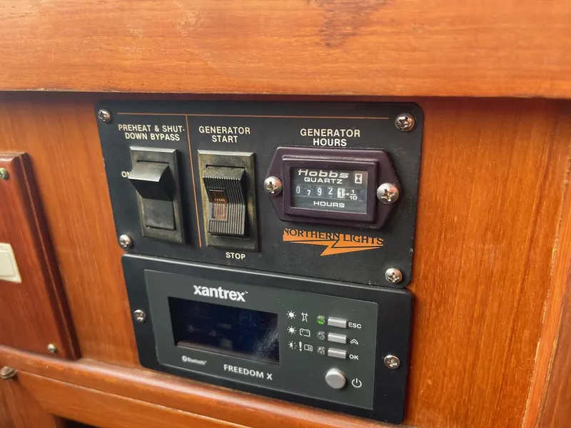 Slide: The Image of Control panel of a 1988 Kha Shing 40 Sundeck boat with generator and inverter. - 25