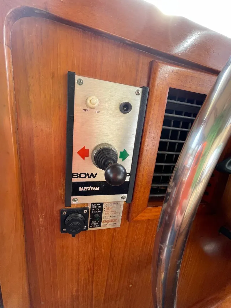 Slide: The Image of Control panel of a 1988 Kha Shing 40 Sundeck boat with bow thruster joystick. - 26