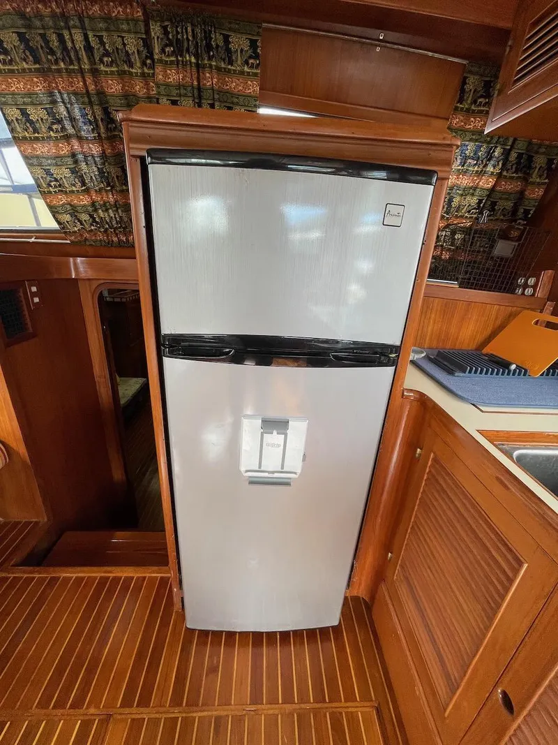 Slide: The Image of Stainless steel refrigerator in the kitchen of a 1988 Kha Shing 40 Sundeck yacht. - 29