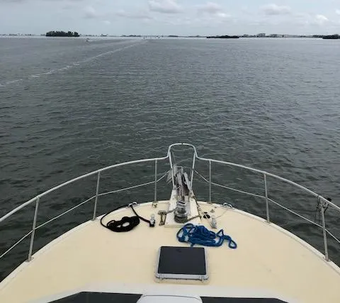 Slide: The Image of Bow view of 1988 Kha Shing 40 Sundeck yacht on open water. - 4