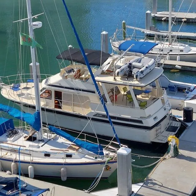 Slide: The Image of 1988 Kha Shing 40 Sundeck yacht docked at a marina. - 41