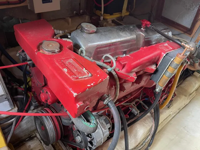 Slide: The Image of 1988 Kha Shing 40 Sundeck engine compartment with red-painted engine. - 45
