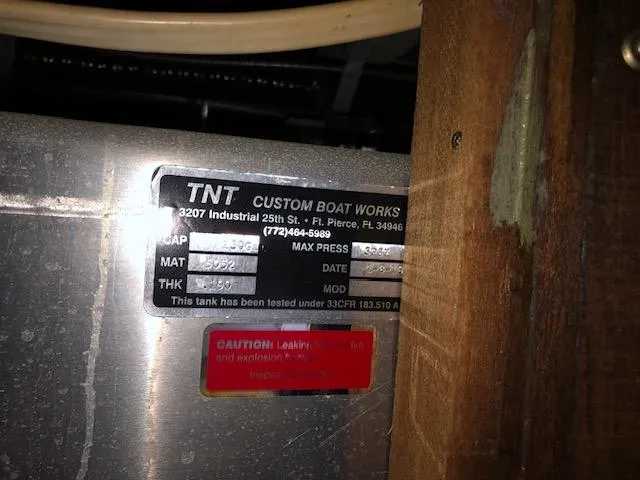 Slide: The Image of Metal label on a 1988 Kha Shing 40 Sundeck boat by TNT Custom Boat Works. - 46