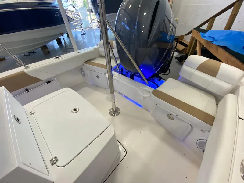 Slide: The Image of 2021 Edgewater 188 CC boat interior with seating and storage compartments. - 5